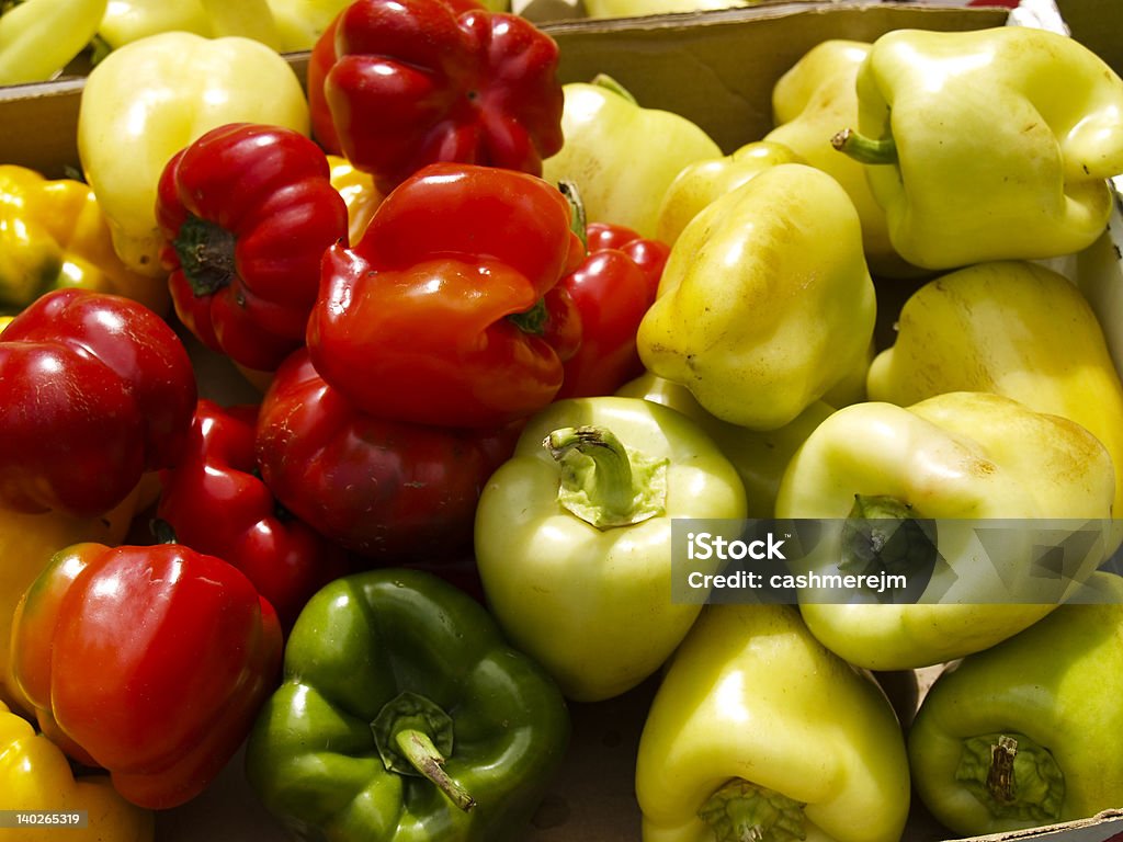 Variety of colors A box of different varieties of peppers at a farmers market. Bell Pepper Stock Photo
