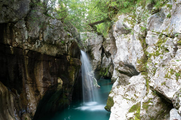 istock Long exposure image of a waterfall on emerald Soca river 1402655514