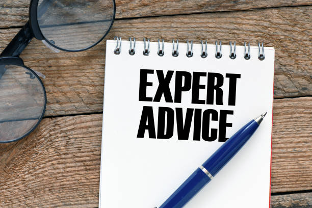istock EXPERT ADVICE words in a notebook on a wooden table. 1402655985