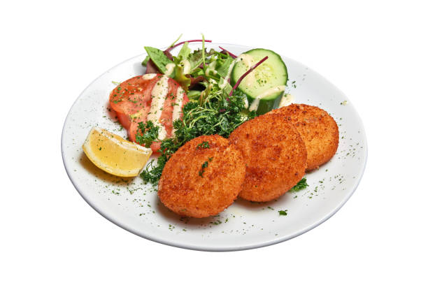 istock White plate with three Cheese croquettes ans salad Isolated 1402658888