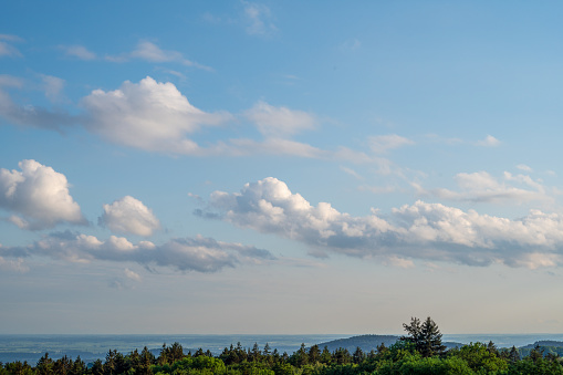 Landscape photos in the Bavarian Forest with fascinating clouds and blue sky