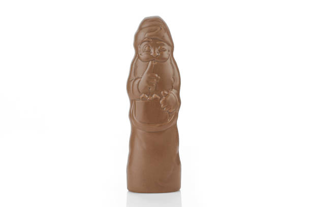 istock Unwrapped chocolate santa claus isolated on white background 1402660408