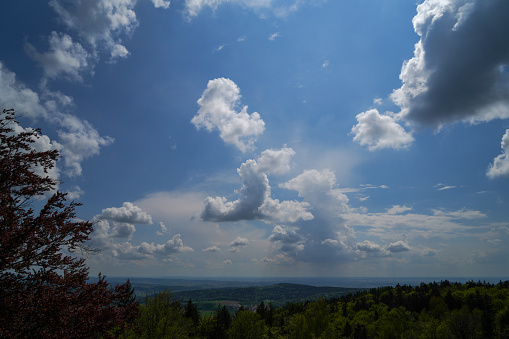 Landscape photos in the Bavarian Forest with fascinating clouds and blue sky