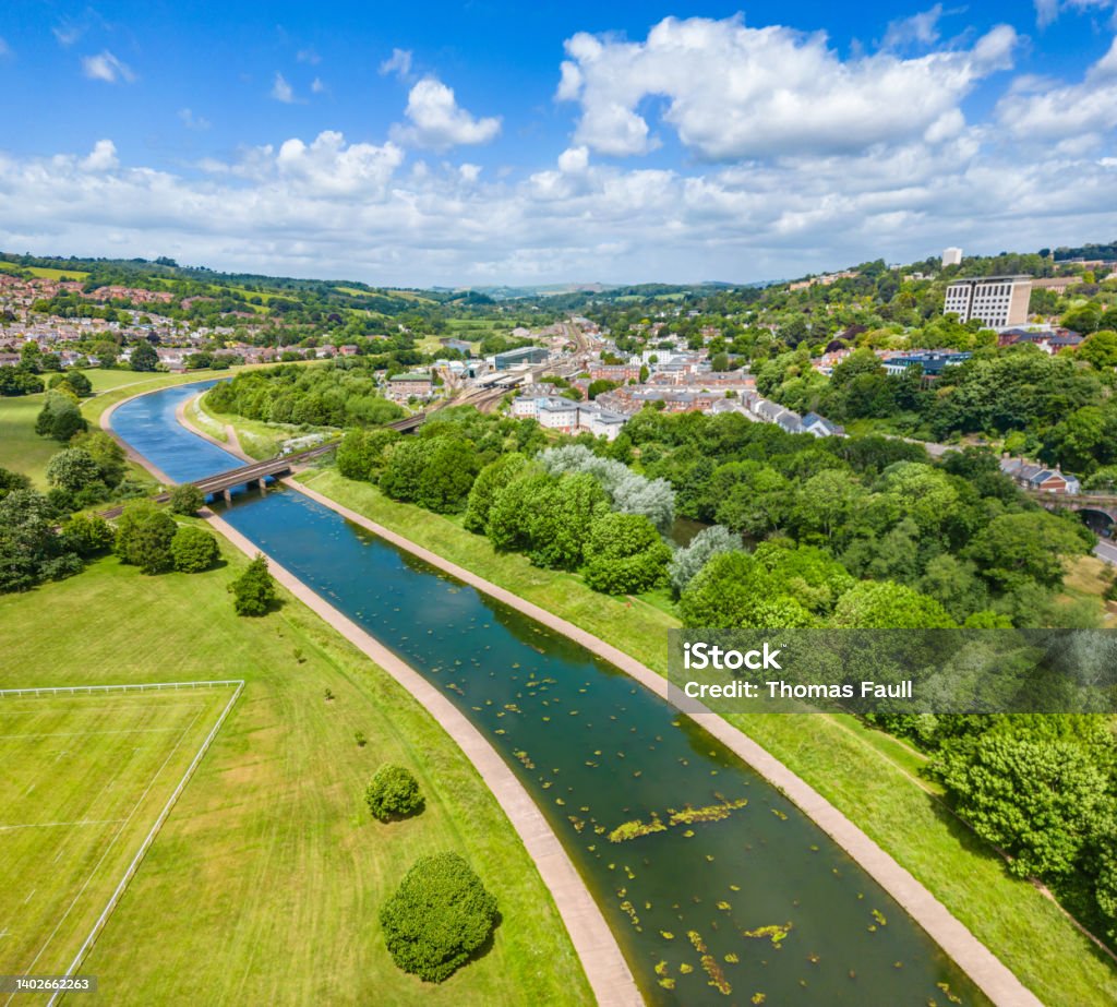 Trainline crosses River Exe towards Exeter St Davids Train Station Devon Stock Photo