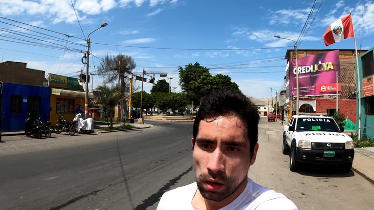 selfie man running through the main square of Casma in point of view in the day