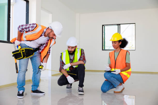istock In doors. Professional Mechanical Engineer team wearing safety hard hat helmet working in  manufacturing factory under construction site. 1402665615