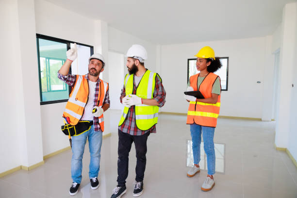 istock In doors. Professional Mechanical Engineer team wearing safety hard hat helmet working in  manufacturing factory under construction site. 1402665639
