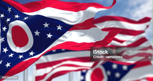 The Ohio State Flag Waving Along With The National Flag Of The United States Of America Stock Photo - Download Image Now