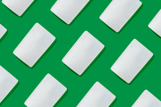istock White cardboards packaging for tea/coffee/snack on green background. Blank tea packaging mockup to demonstrate your branding design. Pattern. 1402667367
