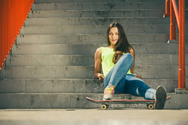 istock Girl on stairs with skateboard. 1402672242