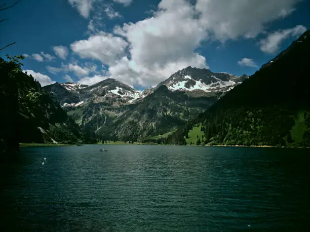 A picture of the Vilsalpsee with the Alps in the Background