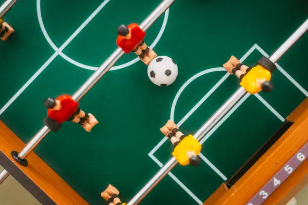 A table football player about to score a goal.