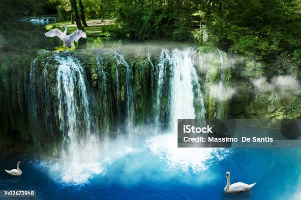 Waterfall Of The River Elsa In The Village Of Colle Di Val Delsa With Three Tuscan Swans Stock Photo - Download Image Now