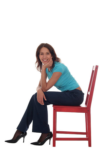 istock Young woman sitting on chair 140267594