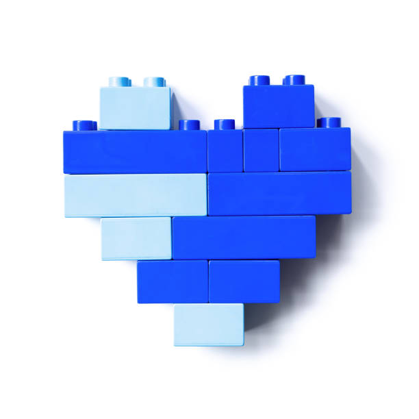 istock Blue heart of plastic building block blocks isolated on white background, top view object, design element, shape heart from child plastic building block. Love concept, Valentine card, Toys, games, two color, light and dark blue 1402679474