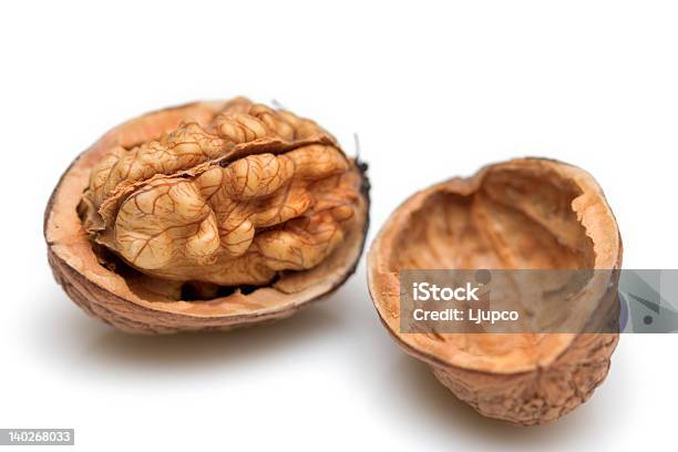 Walnut Shell Cracked In Half To Show Nut Stock Photo - Download Image Now - Brown, Close-up, Cracked