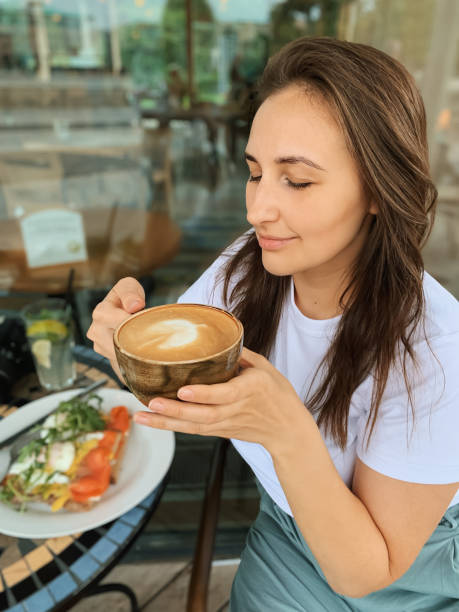 istock The girl drinks coffee with pleasure. 1402681162