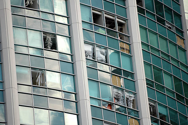 High rise building with damaged and missing window panes