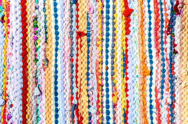 istock Background as handmade doormat from strips of cloth 1402683828
