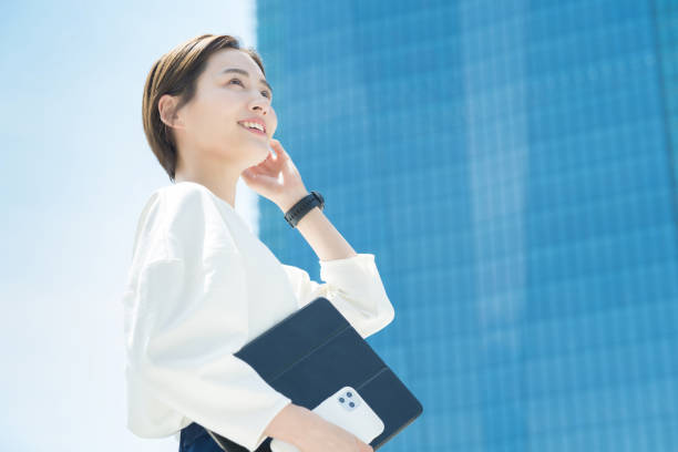 istock A smiling woman standing in the office district 1402685848