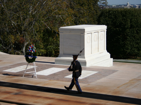 Tomb of the unknown soldier Arlington cemetary with honour guard marching