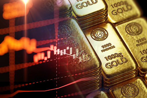 stack of  shiny gold bars on down trend financial gold price graph ,concept of economy crash and financial crisis, 3d illustration