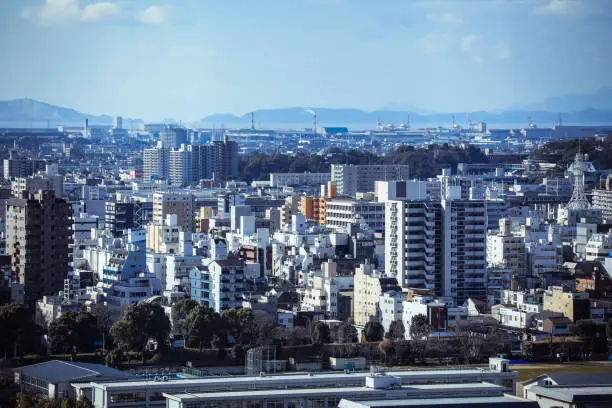 Himeji, Japan - January 08, 2020: Panoramic View to the Himeji city downtown with Business Buildings and Houses