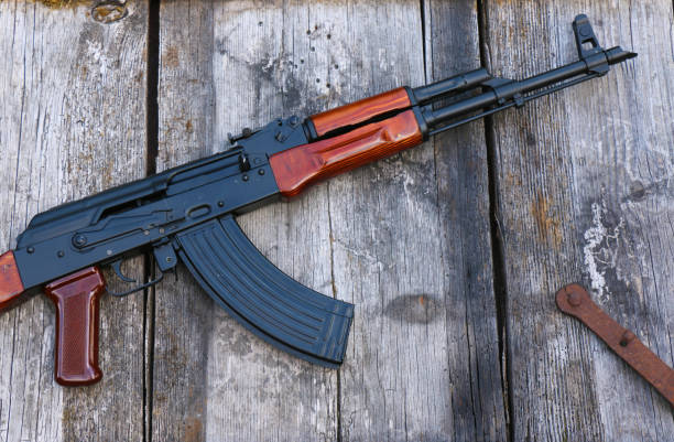 istock The famous Soviet assault rifle on an old, damaged board 1402688148