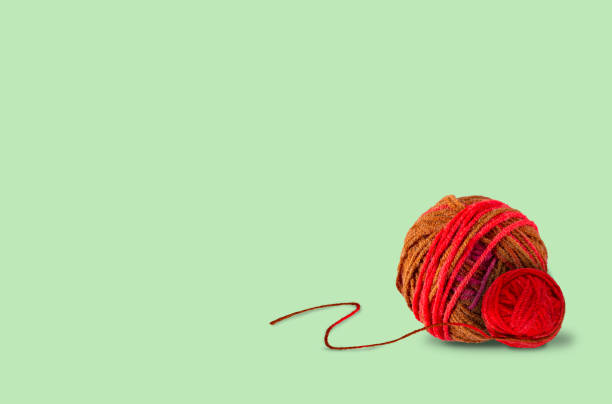 istock balls of wool lie on a green background, selective focus, copy space 1402688987