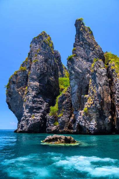 Rocks cliffs in the sea, Ko Yung island, Phi Phi, Andaman sea, K in Krabi Noi, Krabi, Thailand
