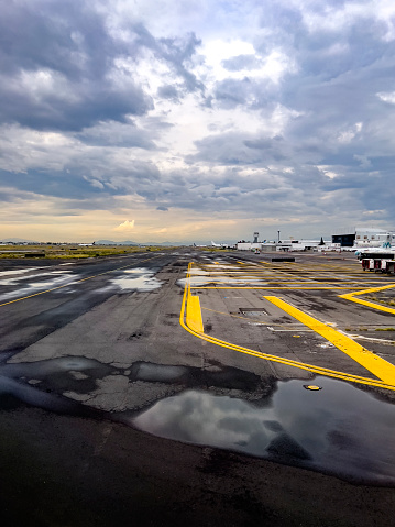 Airplane taxiing at Mexico City Airport after raining