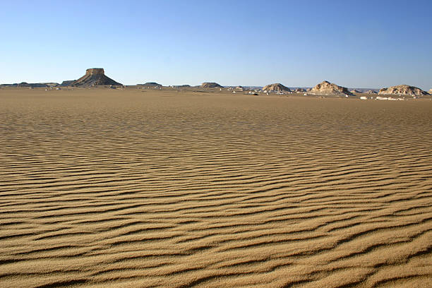 White desert sand ripples all the way stock photo