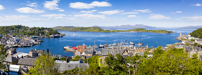 Holidays in Scotland - a panoramic view of Oban with the Isle of Mull in the distance on the west coast of Scotland
