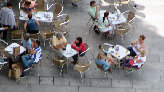 People Sitting Down, Talking To One Another, Eating And Drinking In Restaurant During The Day In Porto City Portugal Iberian Peninsula Europe