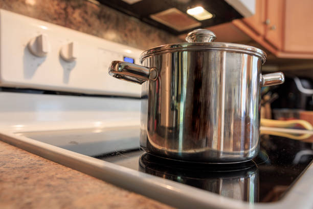 istock Cooking pot on a cooking surface of the electrical kitchen oven 1402691592
