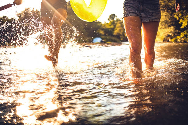 Two women are having fun in the river
