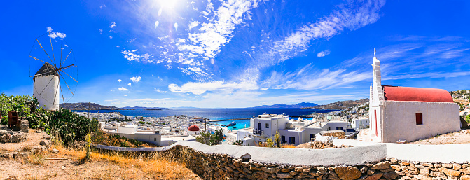 Traditional Greece. Cyclades, beautiful Mykonos island. Panoramic view of old town with windmill . Greek summer holidays