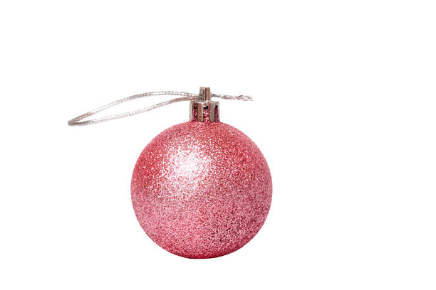 istock New Year concept. Toy with glitter layer pink on Christmas tree isolate on white. 1402693161