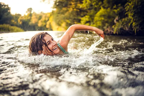 Woman is bathing in the river