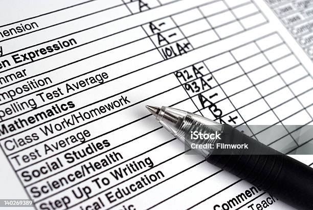 Close Up Of A Report Card With A Pen Stock Photo - Download Image Now - Report Card, School Building, Educational Test Results