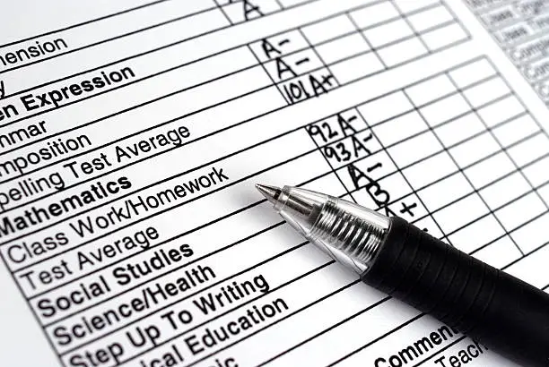 Photo of Close up of a report card with a pen