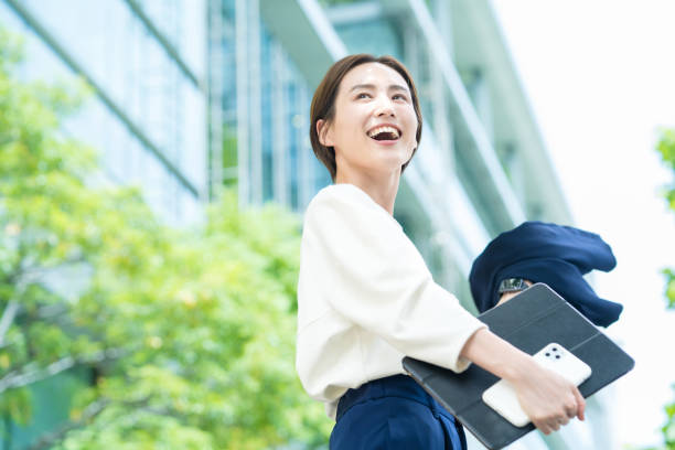 istock A smiling woman standing in the office district 1402694227