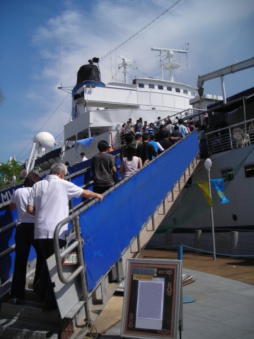           Passengers boarding a ship ready to go on a long journey