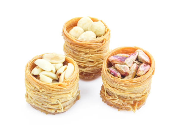 istock Kadayif and nuts nests. Turkish delicacy assorted and isolated on white background 1402697125