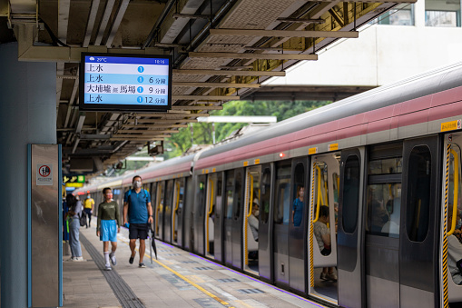 Hong Kong - June 12, 2022 : Passengers at East Rail Line Kowloon Tong Station in Hong Kong. The cross-harbour extension of the East Rail line fully opened on May 15.