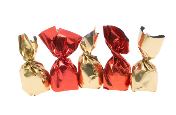 istock chocolate candies in wrapper isolated 1402697526