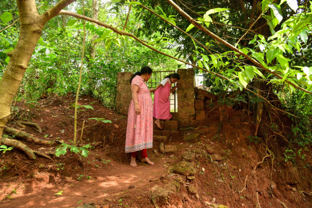 istock mother and daughter walking around village 1402700526
