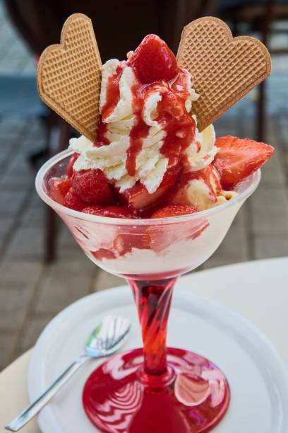 Strawberry cup with fresh strawberries on vanilla ice cream in a German ice cream parlor