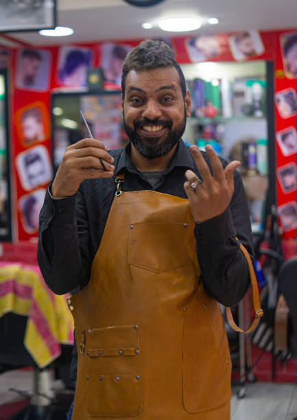 istock Happy barber arab man portrait with scissors 1402702720
