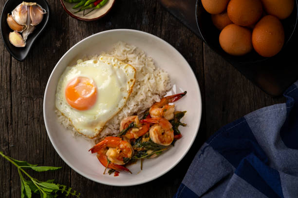 istock Cooked rice and Stir Fried Basil with Shrimp and Fried Egg 1402704179